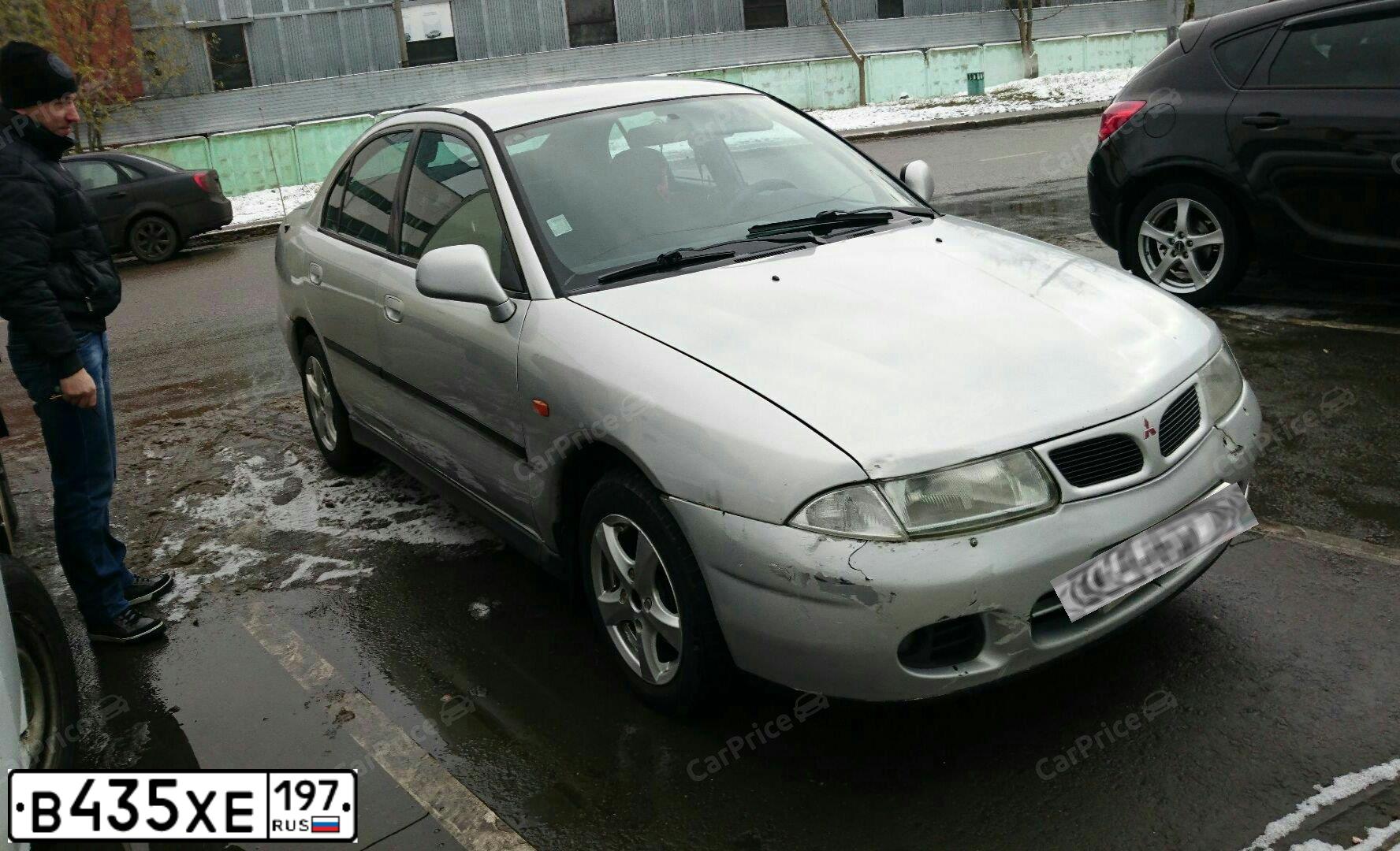 Фото автомобиля MITSUBISHI CARISMA, 1997 — госномер У035АХ76. Цвет: Серебристый