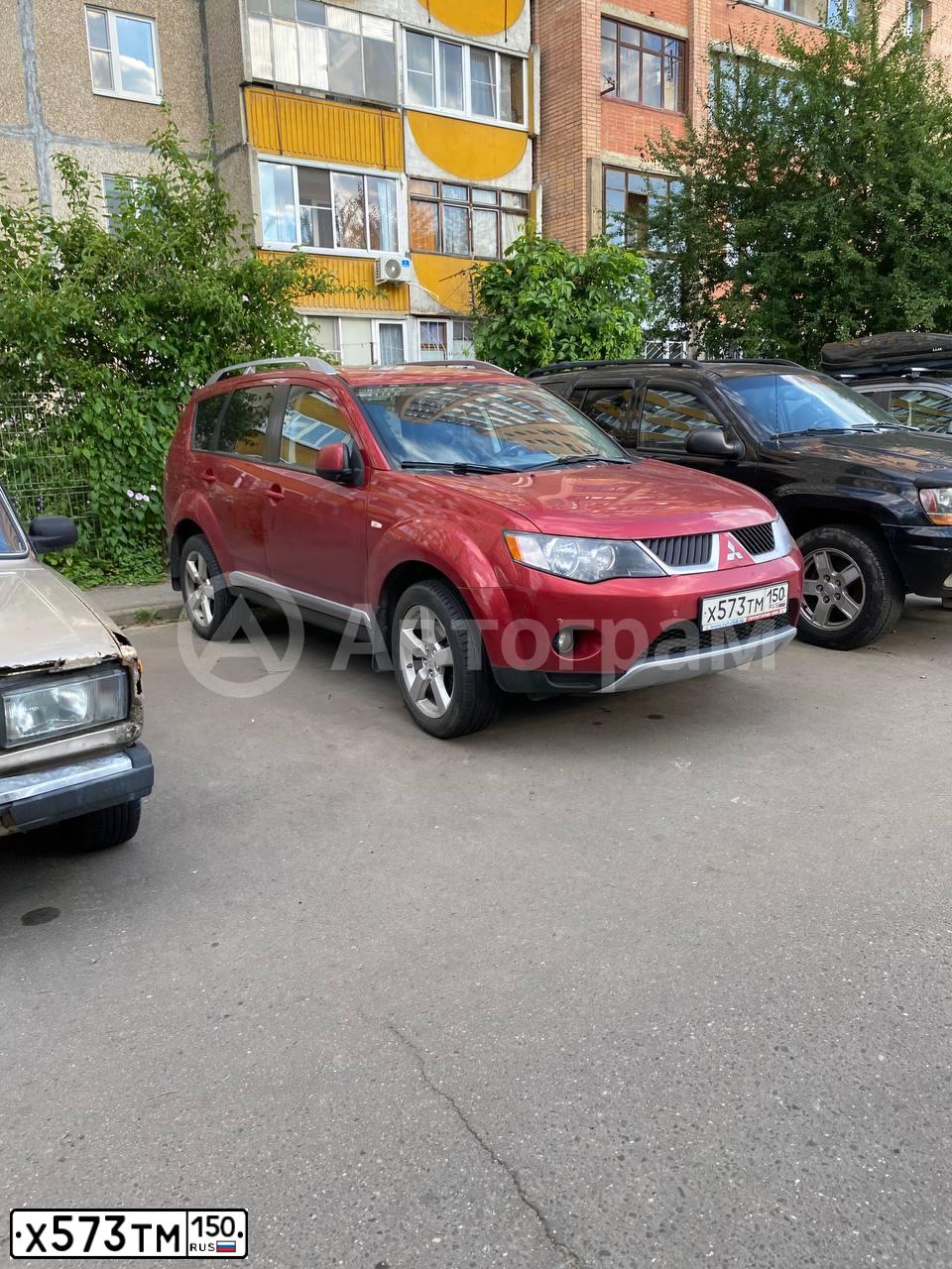Фото автомобиля MITSUBISHI OUTLANDER, 2008 — госномер Х573ТМ150. Цвет: КРАСНЫЙ