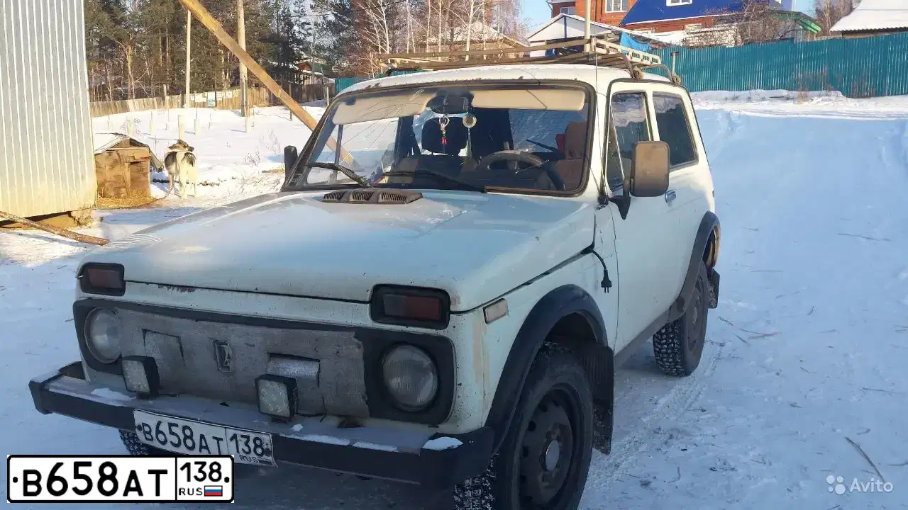 Фото автомобиля LADA 2121 NIVA, 1997 — госномер С196МТ38. Цвет: БЕЛЫЙ