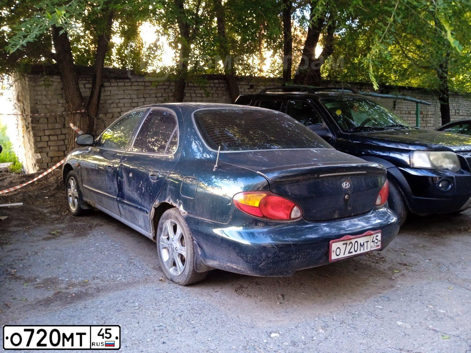 Фото автомобиля HYUNDAI AVANTE, 1998 — госномер О720МТ45. Цвет: Темно-зеленый