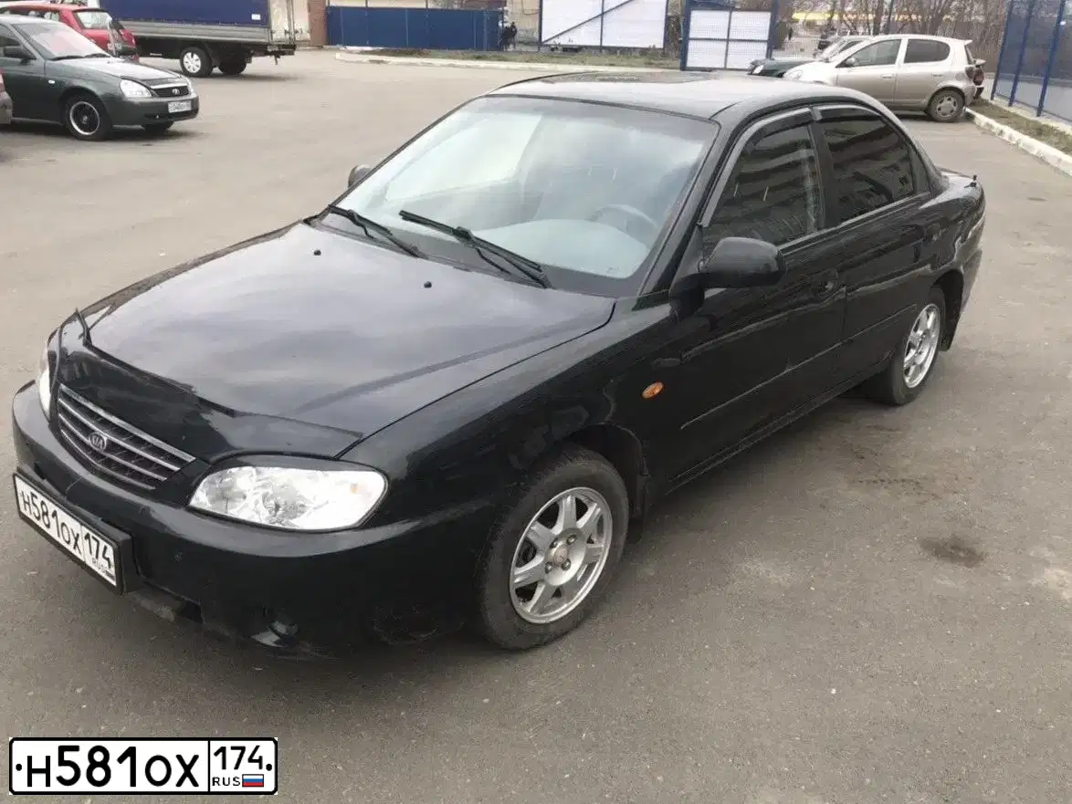 Фото автомобиля KIA SPECTRA, 2006 — госномер С576УВ174. Цвет: Черный графит (черный)