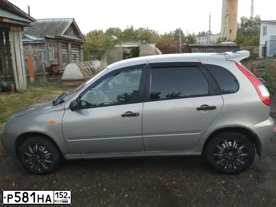 Фото автомобиля LADA 1119 KALINA, 2006 — госномер Р581НА152. Цвет: БЕЖЕВО-СЕРЫЙ