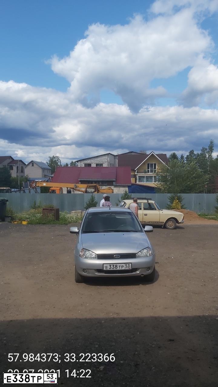Фото автомобиля LADA 1117 KALINA, 2011 — госномер Е338ТР53. Цвет: Серебристый