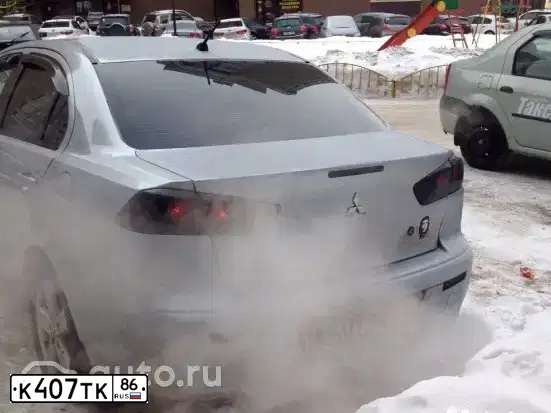Фото автомобиля MITSUBISHI LANCER, 2008 — госномер К407ТК86. Цвет: Серебристый
