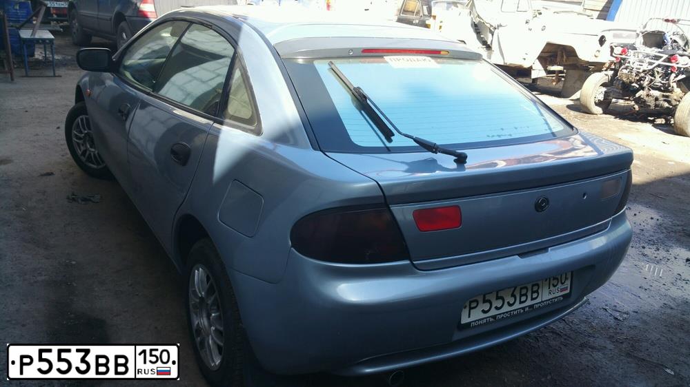 Фото автомобиля MAZDA 323, 1997 — госномер Х745МХ136. Цвет: серебристый