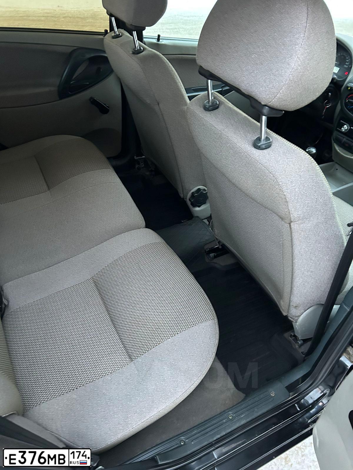 Фото автомобиля LADA 1117 KALINA, 2010 — госномер М597ЕУ774. Цвет: ЧЕРНЫЙ