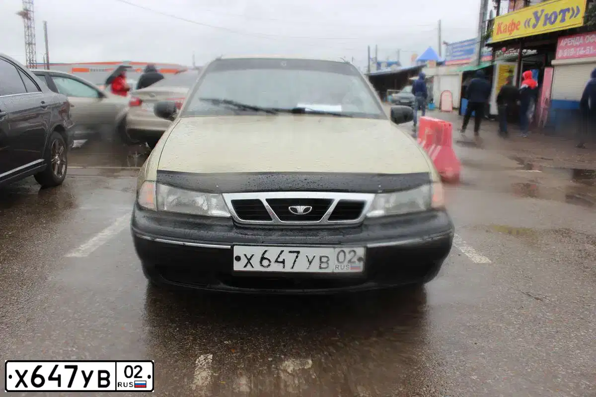 Фото автомобиля DAEWOO NEXIA, 2006 — госномер Х647УВ02. Цвет: ЖЕЛТЫЙ (ПЕСОЧНЫЙ)