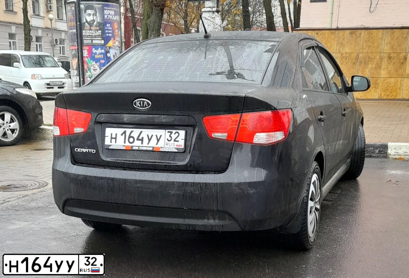 Фото автомобиля KIA CERATO, 2011 — госномер Н164УУ32. Цвет: ЧЕРНЫЙ