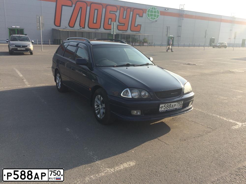 Фото автомобиля TOYOTA COROLLA, 1994 — госномер К804ЕА77. Цвет: Красный