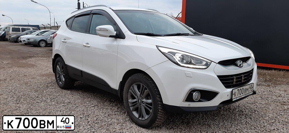 Фото автомобиля KIA SORENTO, 2011 — госномер Р752ЕЕ40. Цвет: Красный