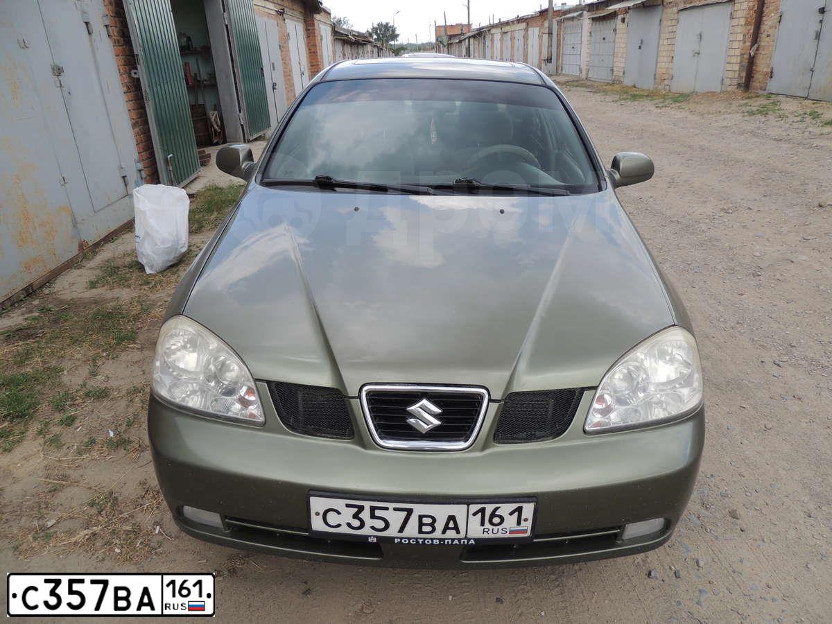 Фото автомобиля SUZUKI FORENZA, 2004 — госномер С357ВА161. Цвет: ЗЕЛЕНО-СЕРЫЙ