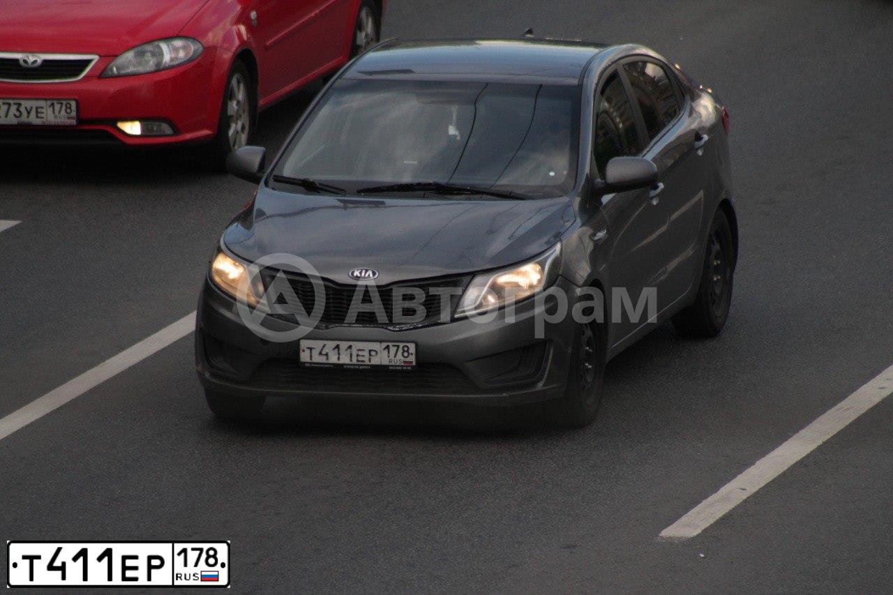 Фото автомобиля KIA RIO, 2014 — госномер Т411ЕР178. Цвет: ТЕМНО-СЕРЫЙ