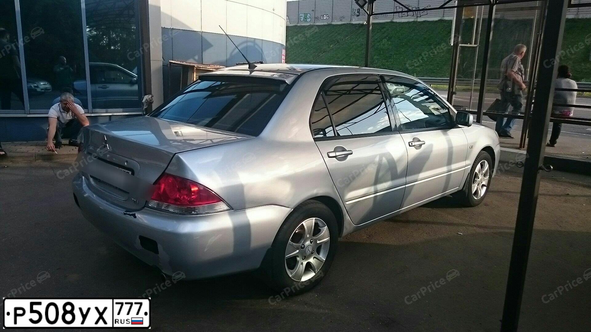 Фото автомобиля MITSUBISHI LANCER, 2003 — госномер К800ОС77. Цвет: СЕРЕБРИСТЫЙ