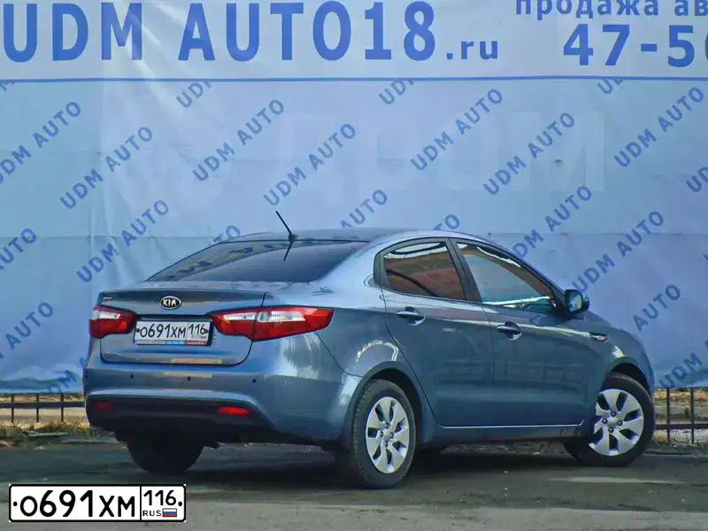 Фото автомобиля KIA RIO, 2012 — госномер К757УС18. Цвет: ГОЛУБОЙ