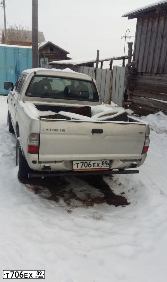Фото автомобиля MITSUBISHI L 200, 2005 — госномер Т691СР72. Цвет: МНОГОЦВЕТНЫЙ