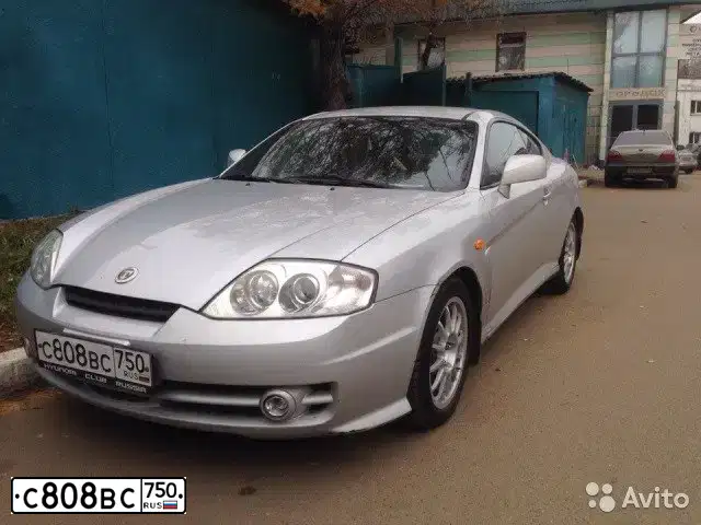 Фото автомобиля HYUNDAI /S-/COUPE / TUSCANI, 2004 — госномер М540ХН196. Цвет: СВЕТЛО СЕРЫЙ