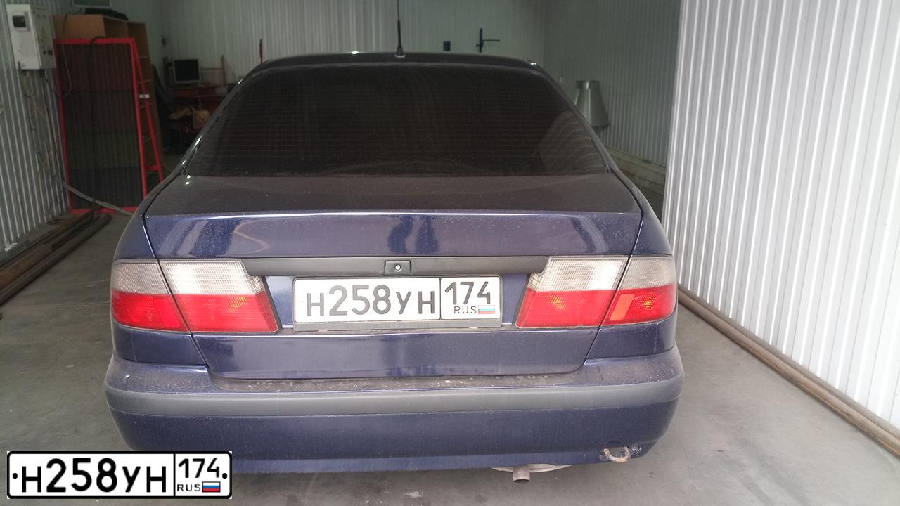 Фото автомобиля NISSAN PRIMERA, 1998 — госномер Н258УН174. Цвет: ПЕРЛАМУТ-ТЕМНО-СИНИЙ
