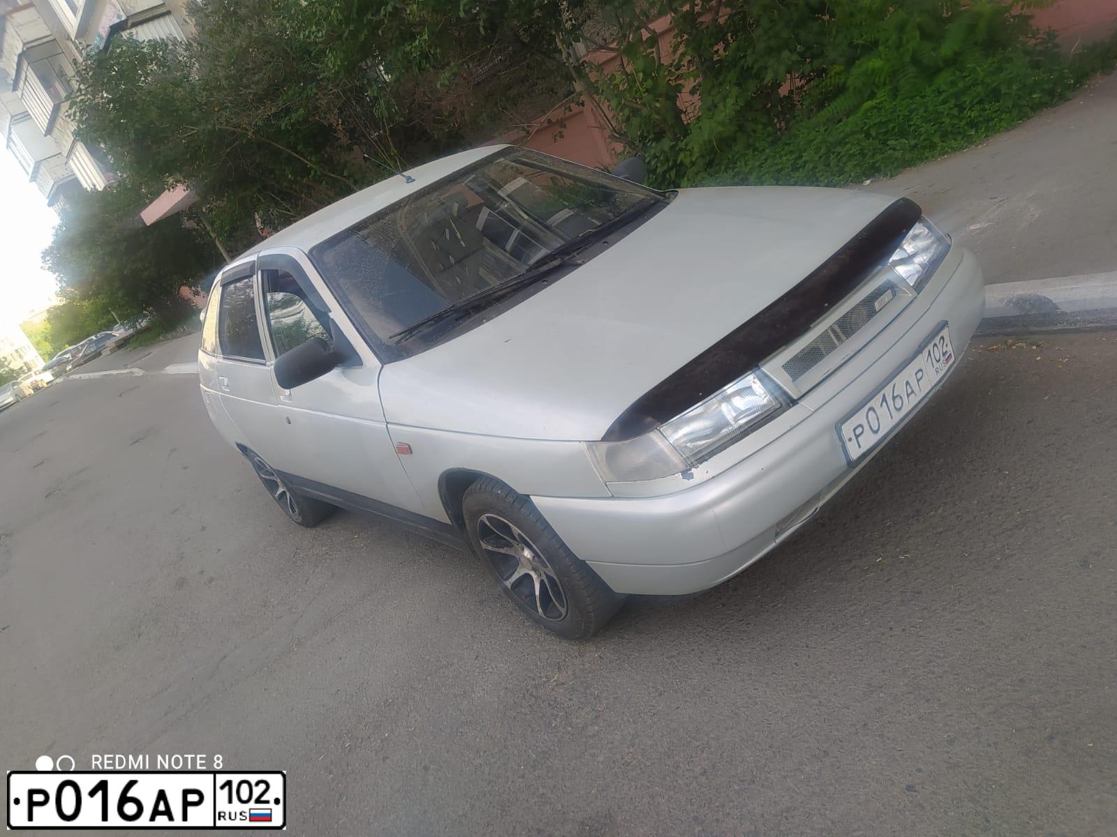 Фото автомобиля LADA 2112, 2005 — госномер К141МВ102. Цвет: МОЛОЧНО-БЕЛЫЙ СЕРЕБРИСТЫЙ