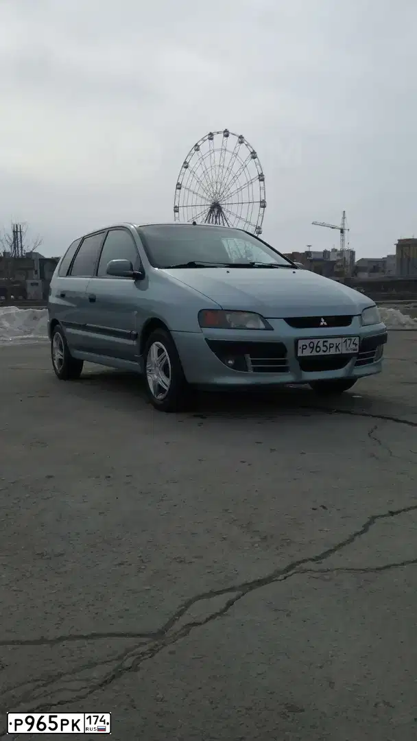 Фото автомобиля MITSUBISHI SPACE STAR, 2004 — госномер В560ХО702. Цвет: СВЕТЛО-СЕРО-ЗЕЛЕНЫЙ