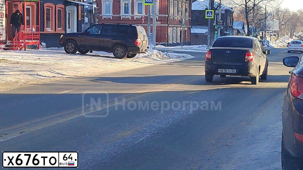Фото автомобиля LADA 2190 GRANTA, 2013 — госномер М612РХ164. Цвет: СИНЕ-ЧЁРНЫЙ