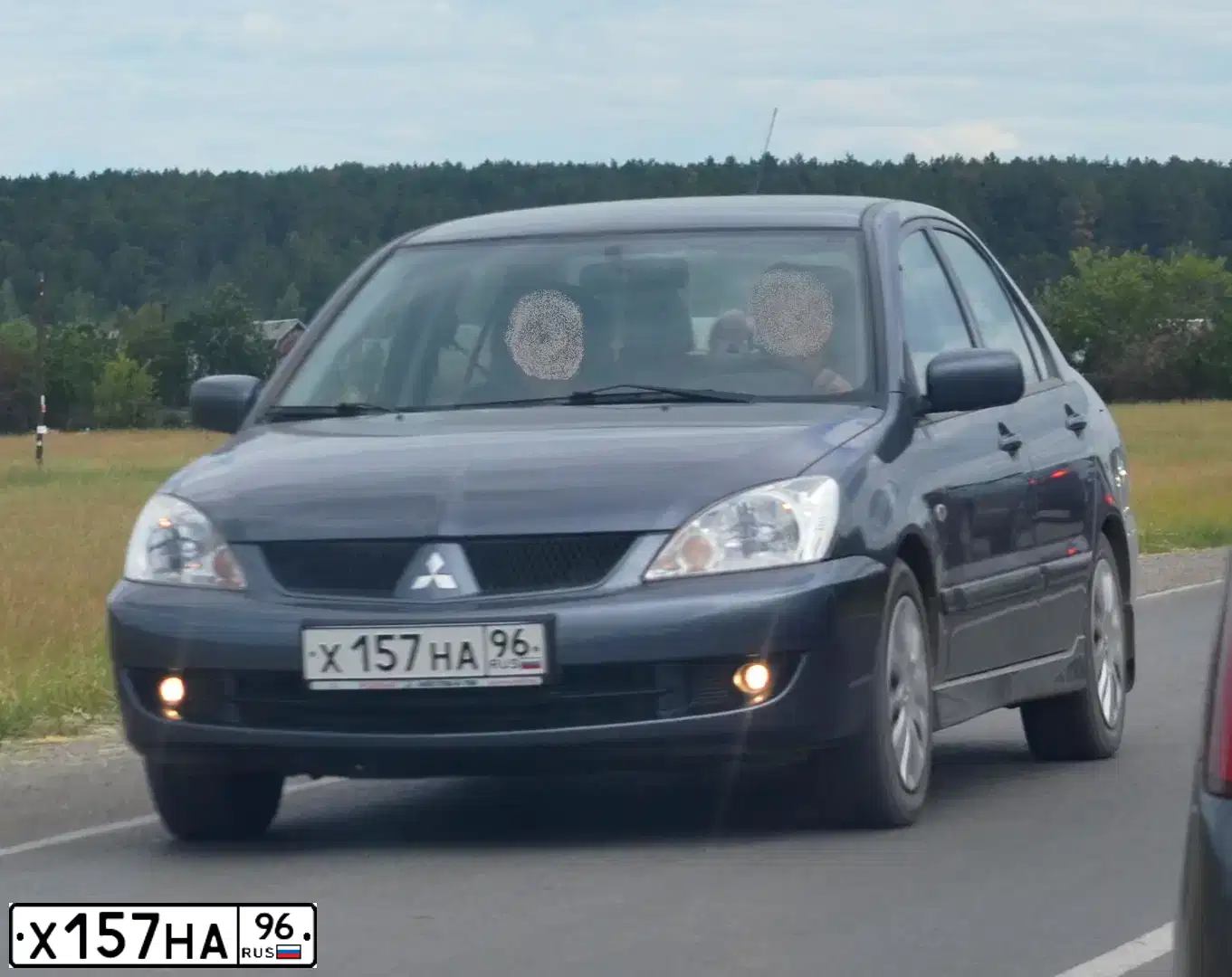 Фото автомобиля MITSUBISHI LANCER, 2006 — госномер Х157НА96. Цвет: СЕРЫЙ
