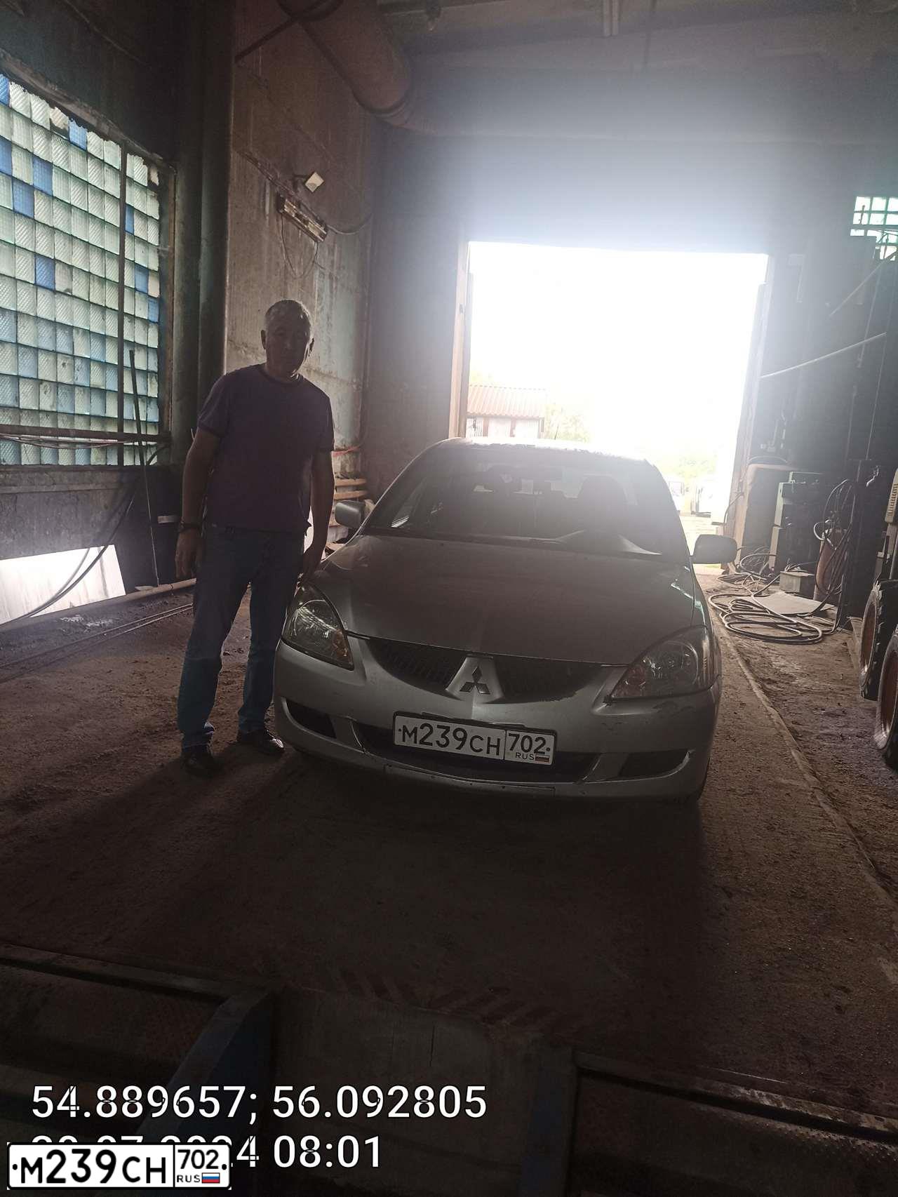 Фото автомобиля MITSUBISHI LANCER, 2005 — госномер М239СН702. Цвет: СЕРЕБРИСТЫЙ
