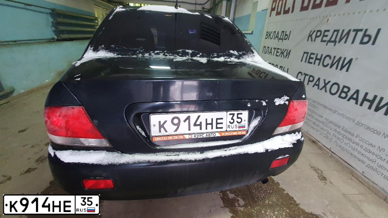 Фото автомобиля MITSUBISHI LANCER, 2006 — госномер О769ТУ44. Цвет: ЧЕРНЫЙ