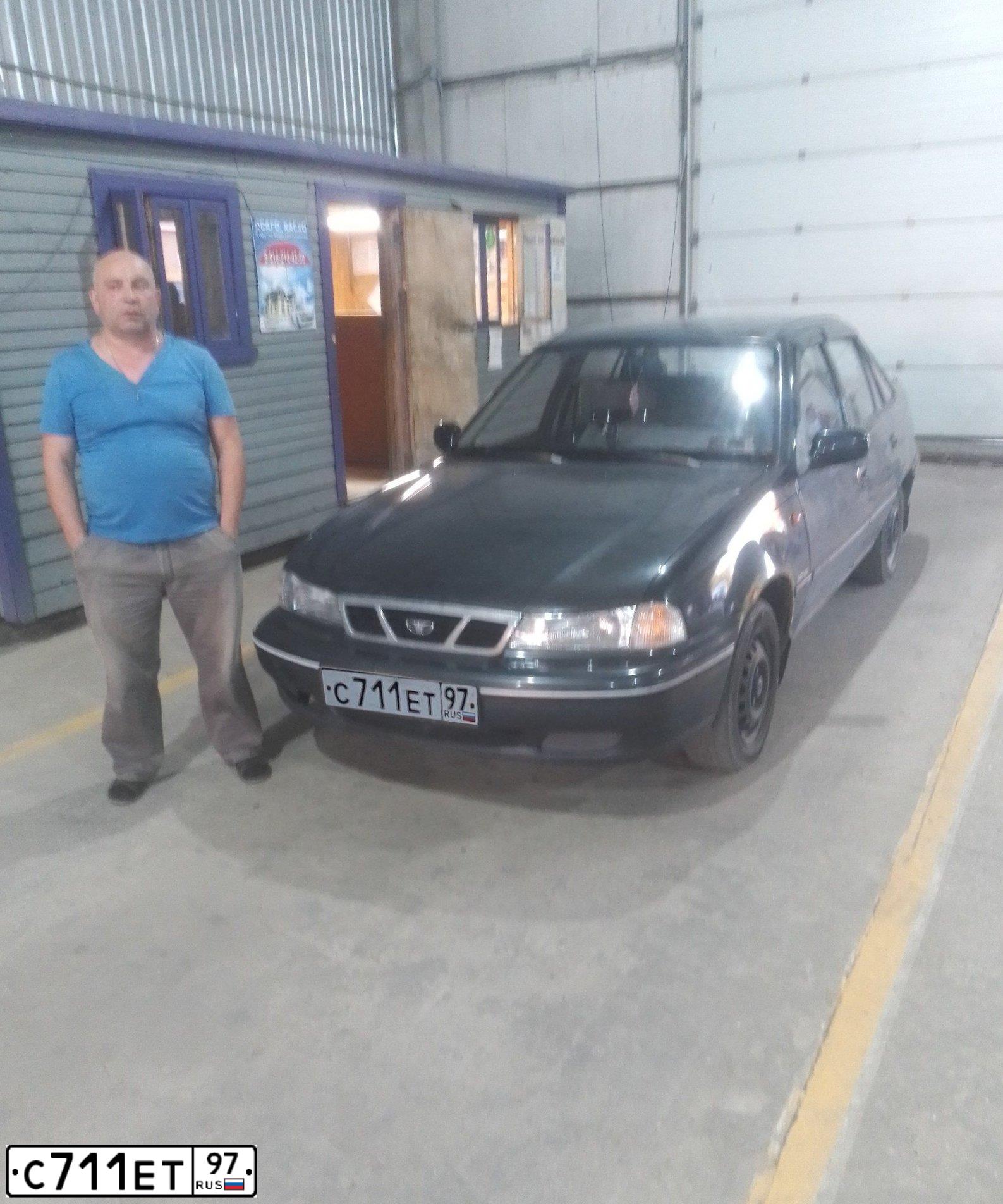 Фото автомобиля DAEWOO NEXIA, 2003 — госномер С711ЕТ97. Цвет: ТЕМНО-ЗЕЛЕНЫЙ
