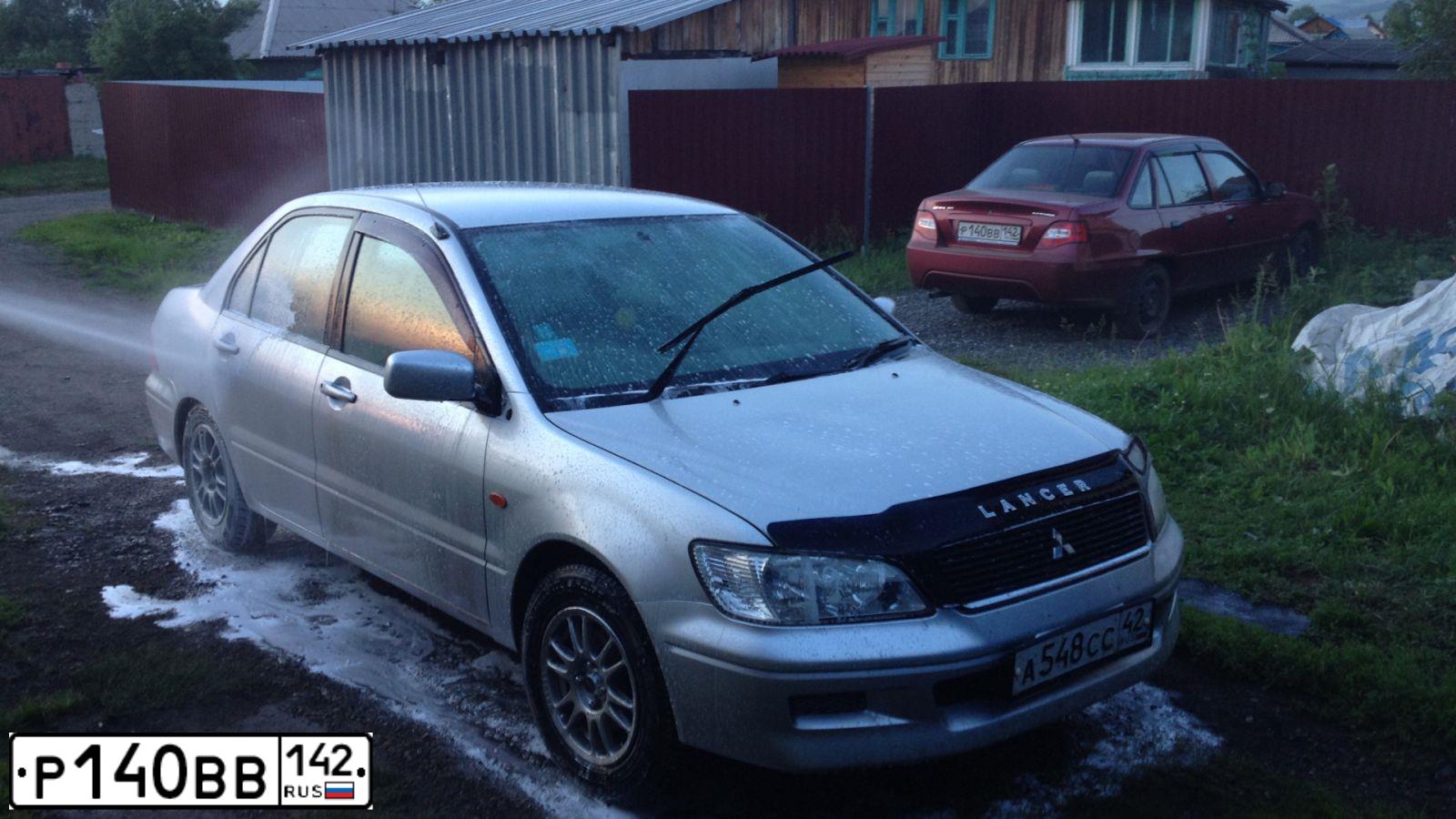 Фото автомобиля DAEWOO NEXIA, 2012 — госномер Р140ВВ142. Цвет: ВИШНЕВЫЙ