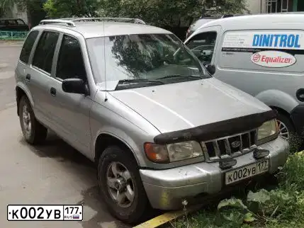 Фото автомобиля KIA SPORTAGE, 2000 — госномер Н613ТР777. Цвет: СЕРЫЙ