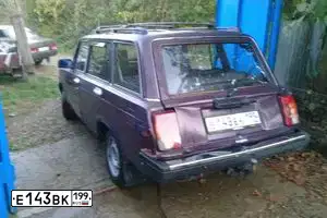 Фото автомобиля LADA 2104, 1997 — госномер Е143ВК199. Цвет: ФИОЛЕТОВЫЙ