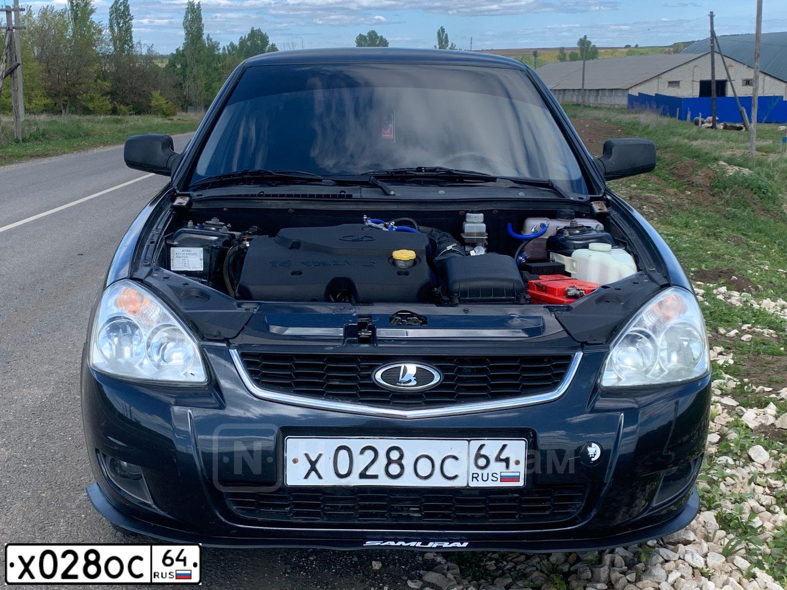 Фото автомобиля LADA 2170 PRIORA, 2010 — госномер Х028ОС64. Цвет: Сине-Черный