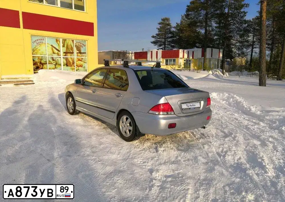 Фото автомобиля MITSUBISHI LANCER, 2004 — госномер А873УВ89. Цвет: Серебристый