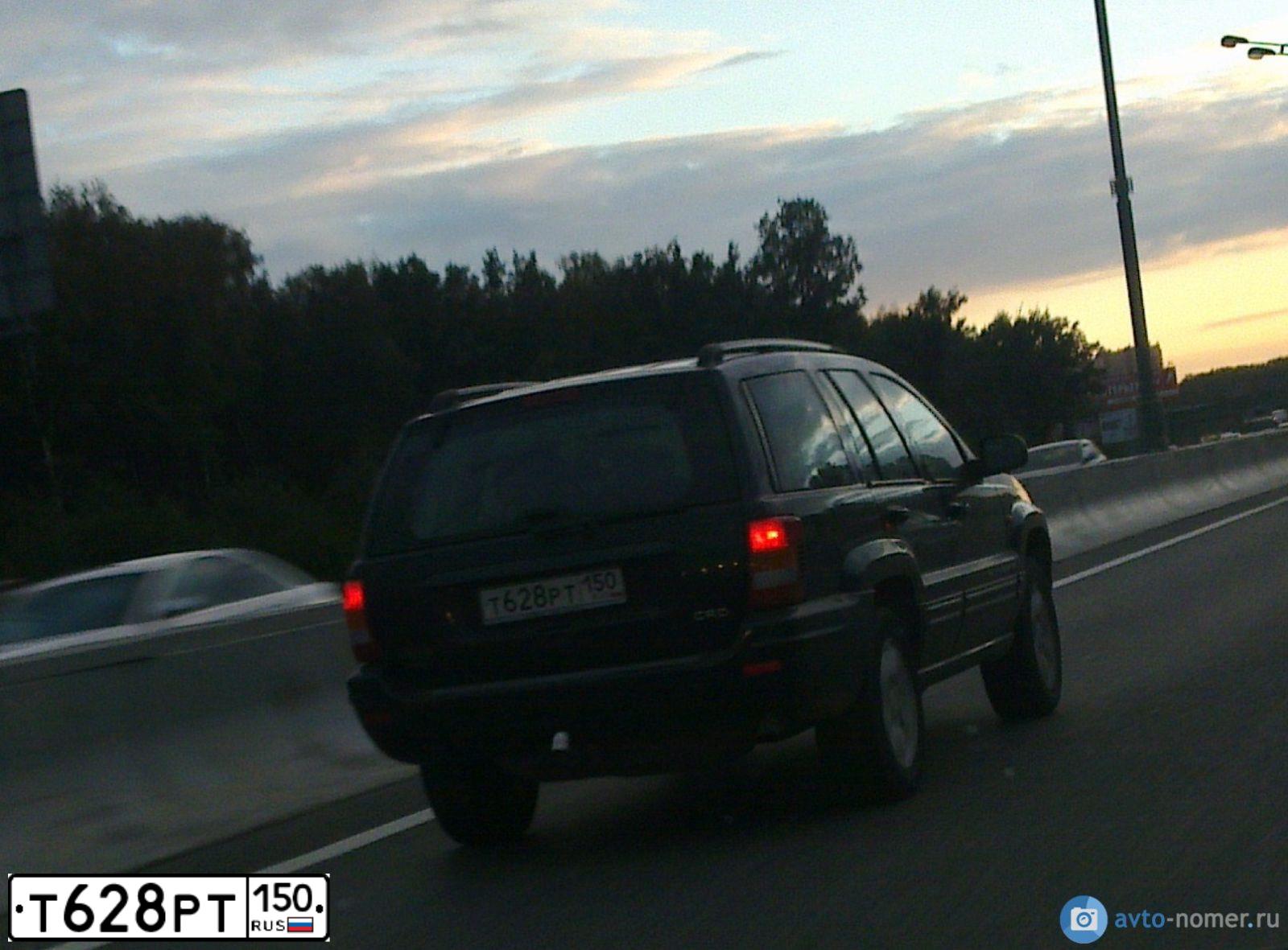 Фото автомобиля JEEP GRAND CHEROKEE, 2003 — госномер С127УУ161. Цвет: ЧЕРНЫЙ