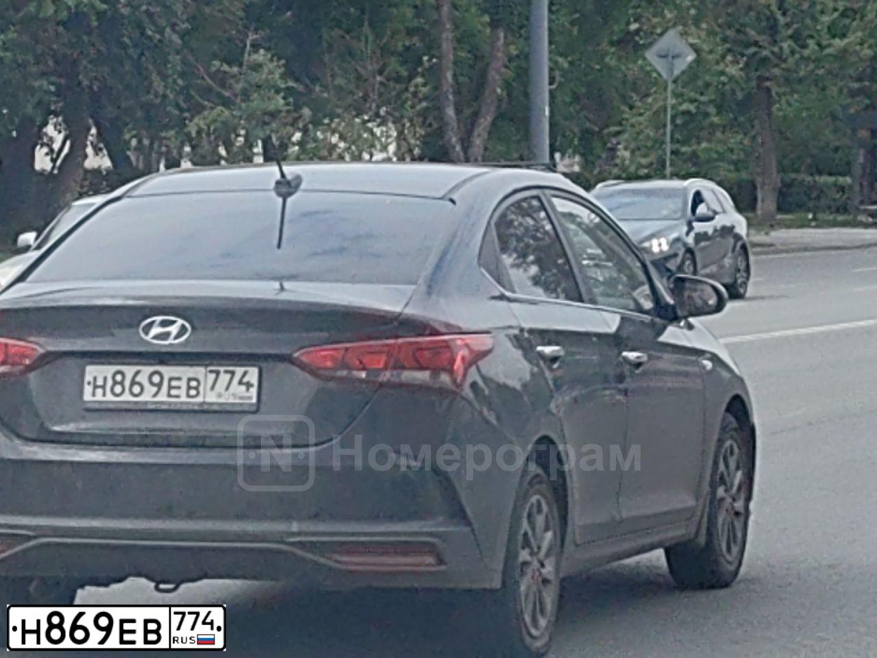 Фото автомобиля HYUNDAI SOLARIS HS, 2024 — госномер Н869ЕВ774. Цвет: ЧЕРНЫЙ