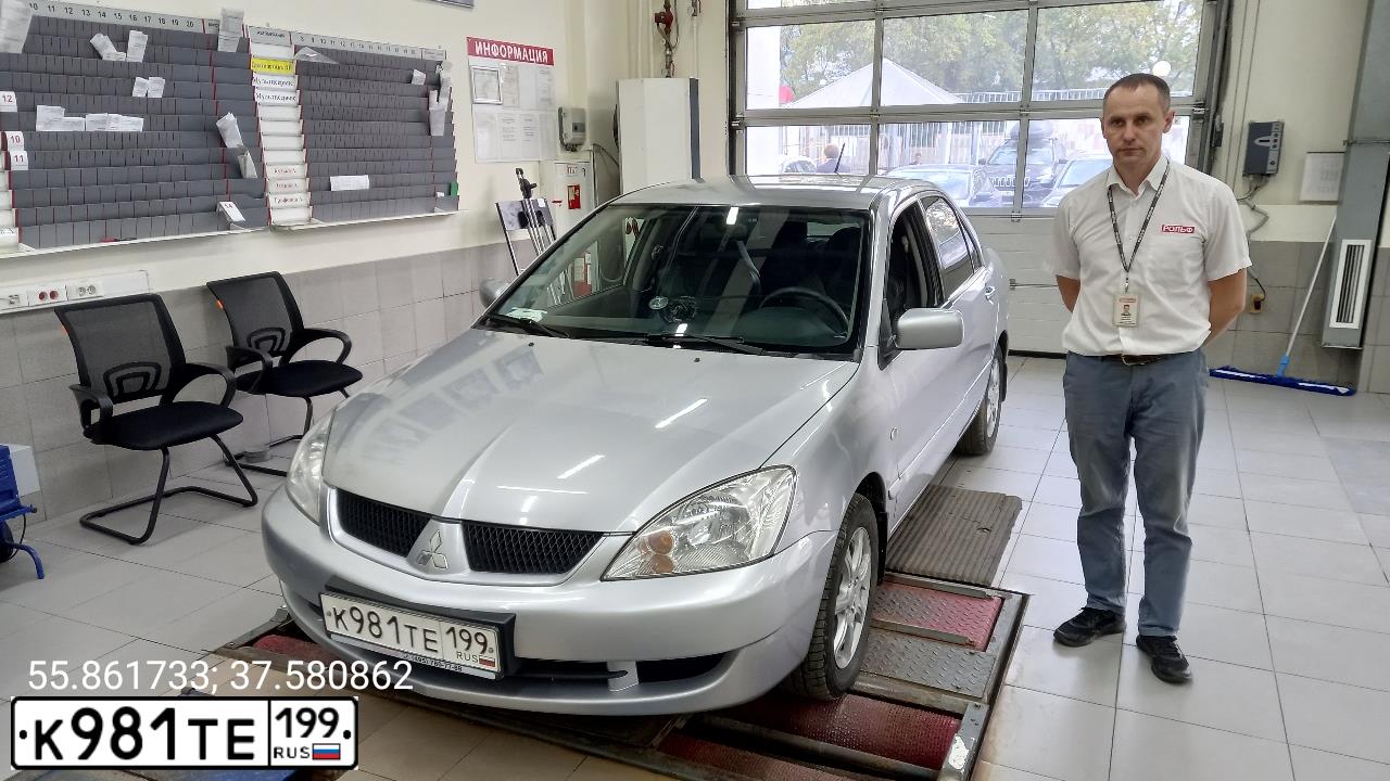 Фото автомобиля MITSUBISHI LANCER, 2009 — госномер К981ТЕ199. Цвет: СЕРЫЙ МЕТАЛЛИК