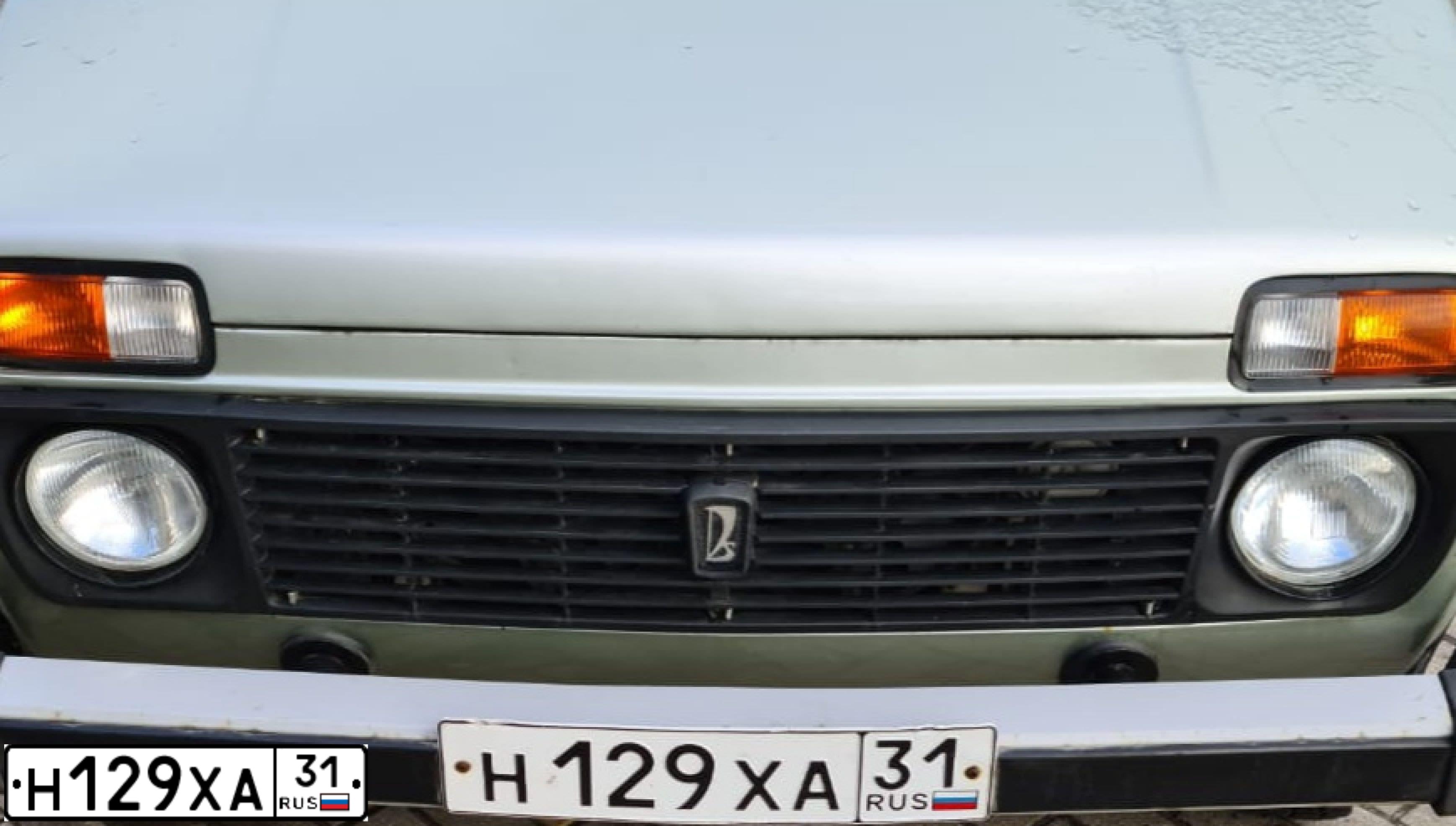 Фото автомобиля LADA 2131 NIVA, 2007 — госномер Н129ХА31. Цвет: БЕЛО-ЗЕЛЕНЫЙ