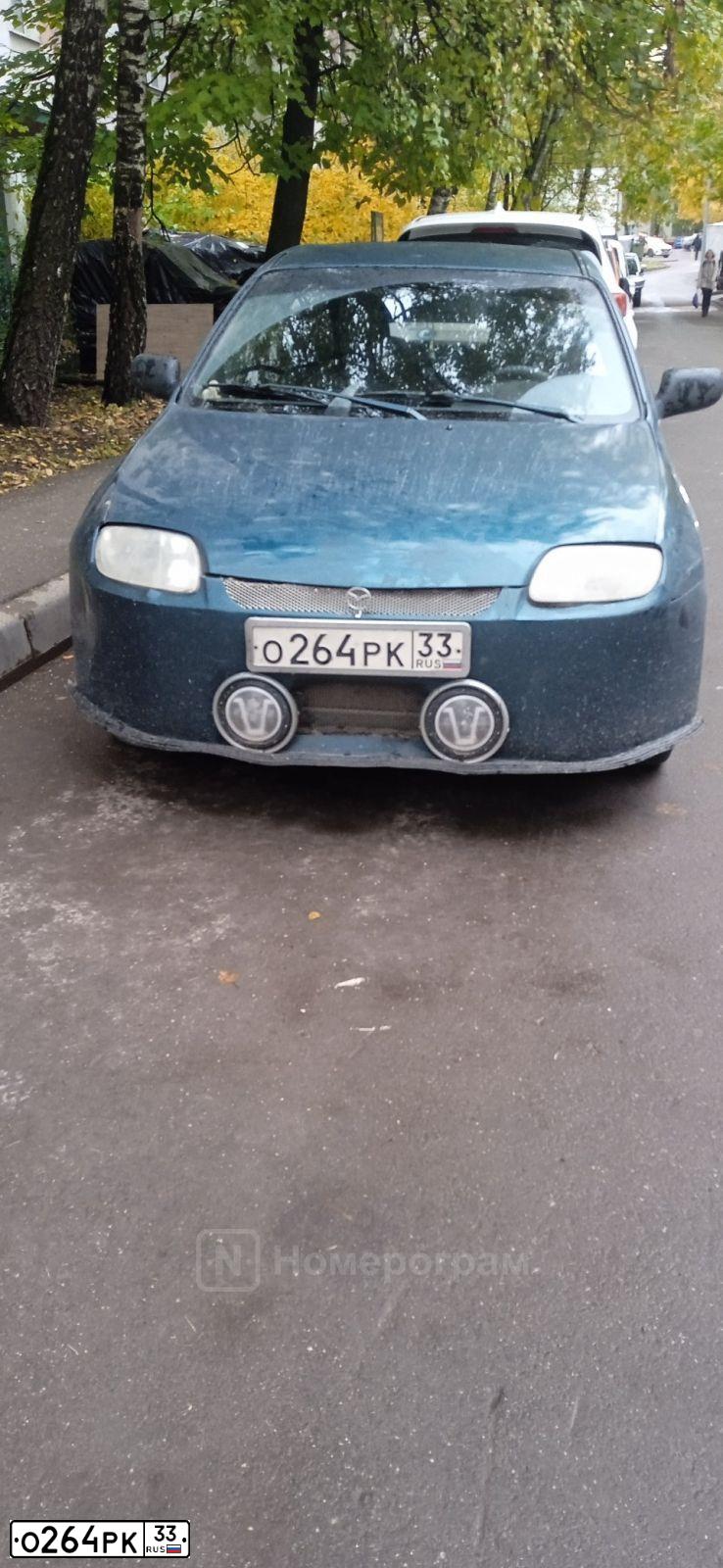 Фото автомобиля MAZDA 323, 1995 — госномер О264РК33. Цвет: ЗЕЛЕНЫЙ