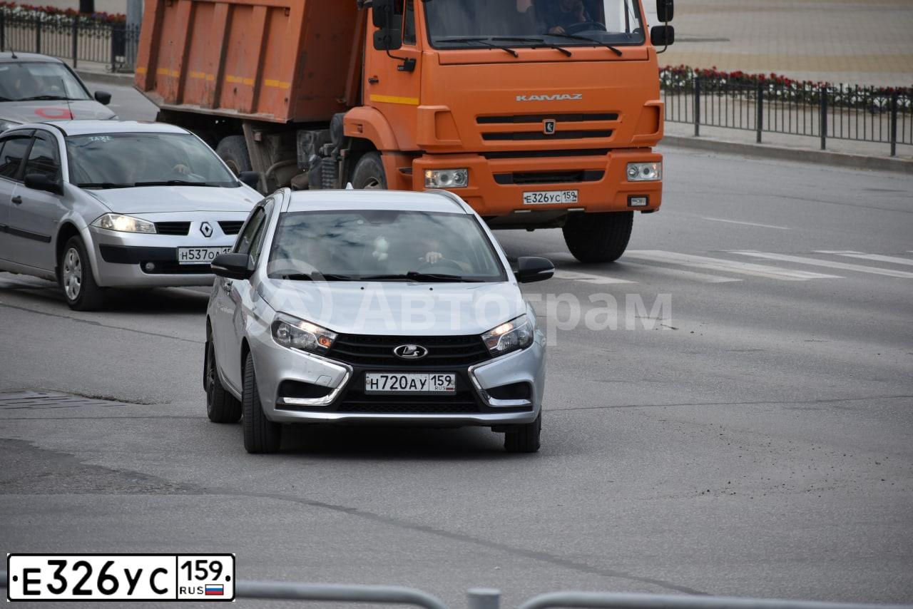 Фото автомобиля KAMAZ 65115 /6X4/, 2014 — госномер Е326УС159. Цвет: ОРАНЖЕВЫЙ