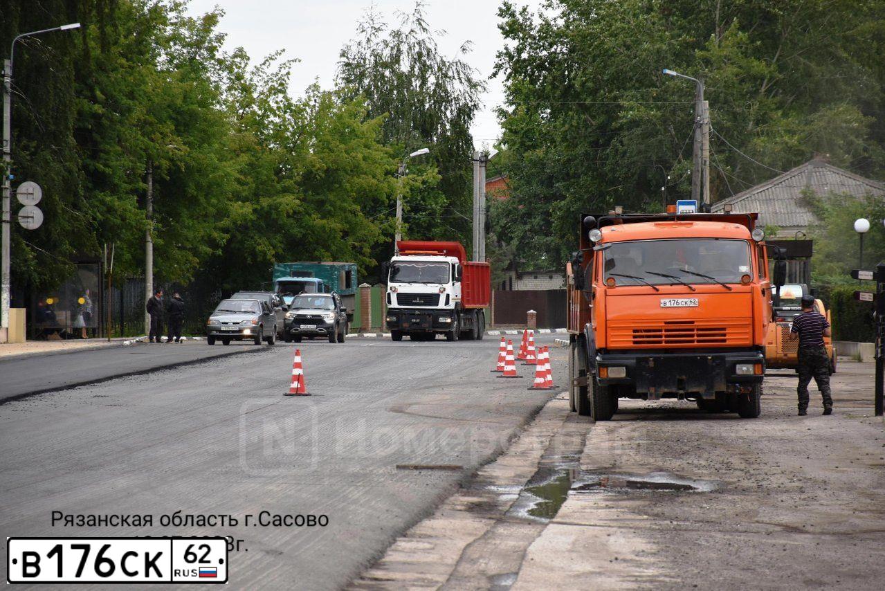 Фото автомобиля KAMAZ 65115 /6X4/, 2009 — госномер Т877ОА62. Цвет: ОРАНЖЕВЫЙ