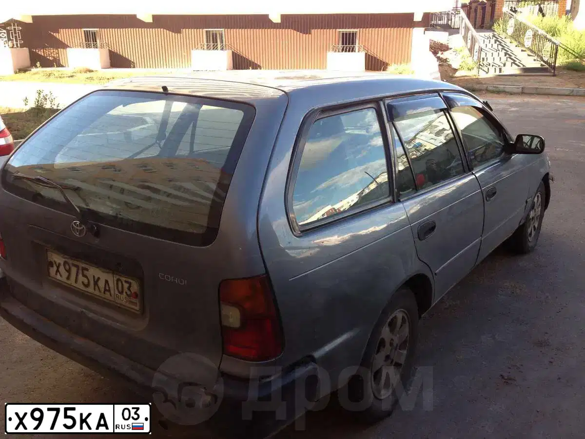 Фото автомобиля TOYOTA COROLLA, 2001 — госномер Х975КА03