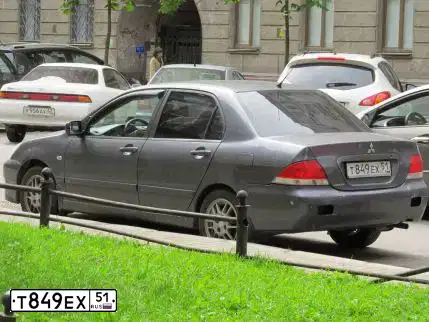 Фото автомобиля MITSUBISHI LANCER, 2006 — госномер К256РС82. Цвет: СЕРЫЙ