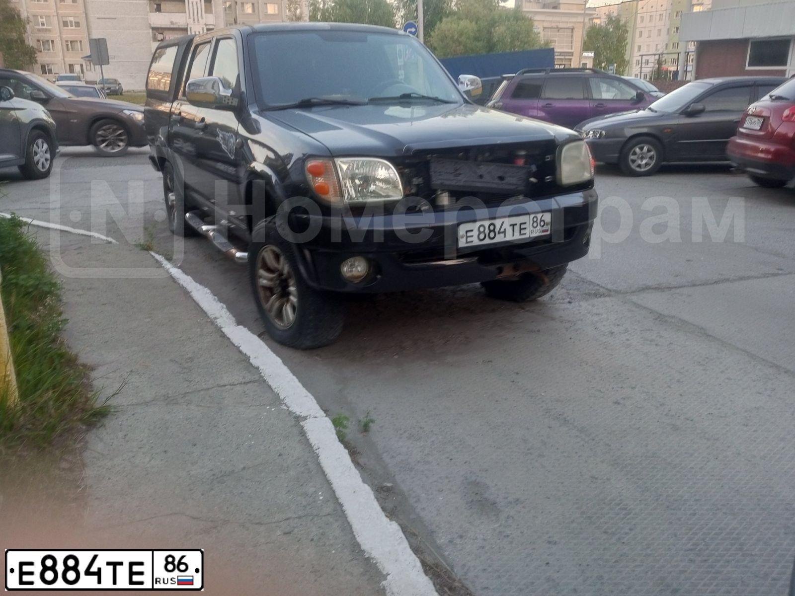 Фото автомобиля ZX-AUTO GRAND TIGER, 2007 — госномер Е884ТЕ86. Цвет: ЧЕРНЫЙ