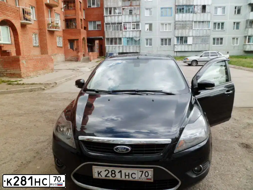 Фото автомобиля FORD FOCUS, 2009 — госномер К281НС70. Цвет: ЧЕРНЫЙ