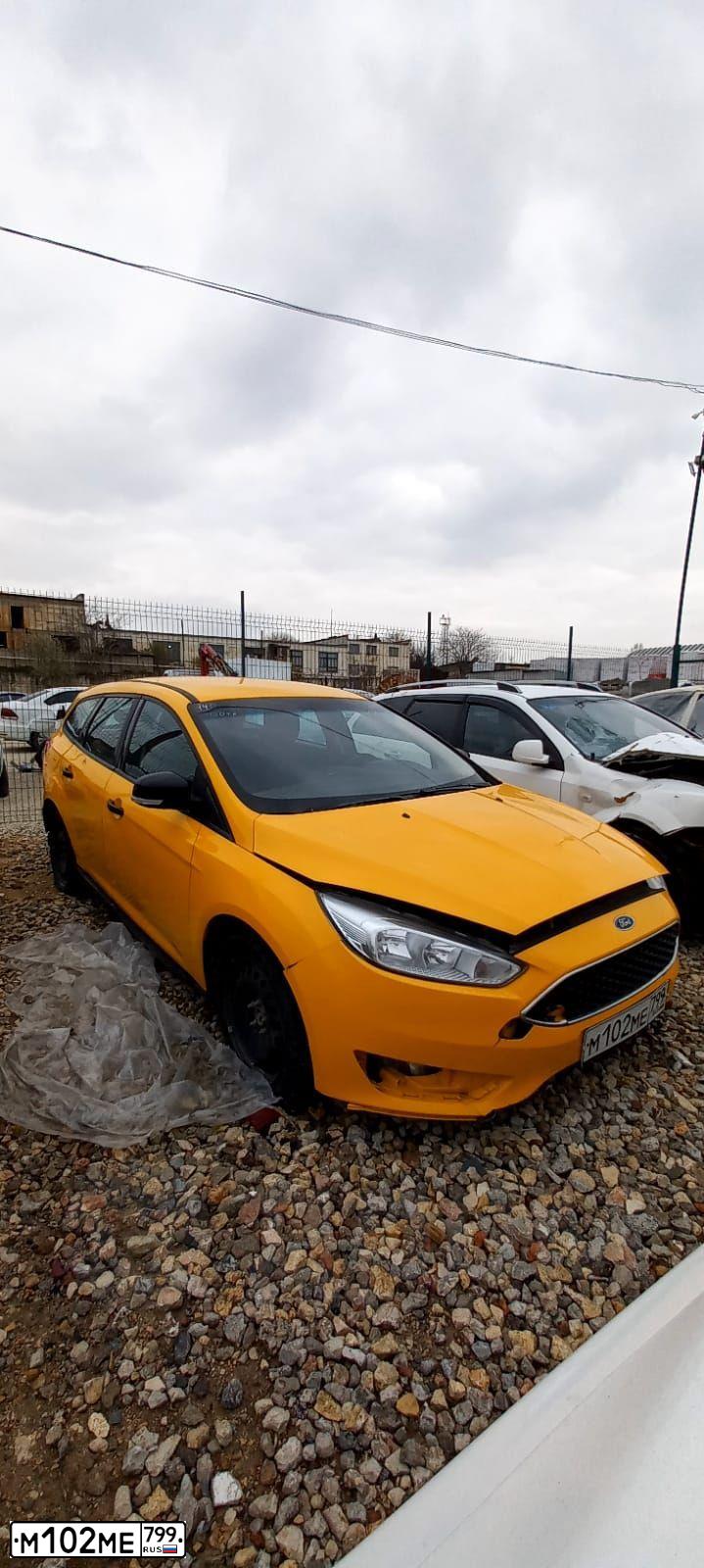 Фото автомобиля FORD FOCUS, 2016 — госномер М102МЕ799. Цвет: ЖЕЛТЫЙ