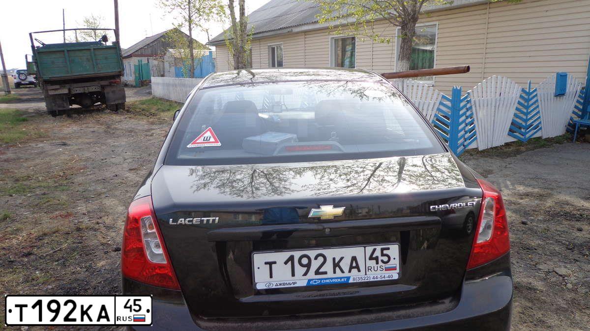 Фото автомобиля CHEVROLET LACETTI, 2010 — госномер Т192КА45. Цвет: ЧЕРНЫЙ