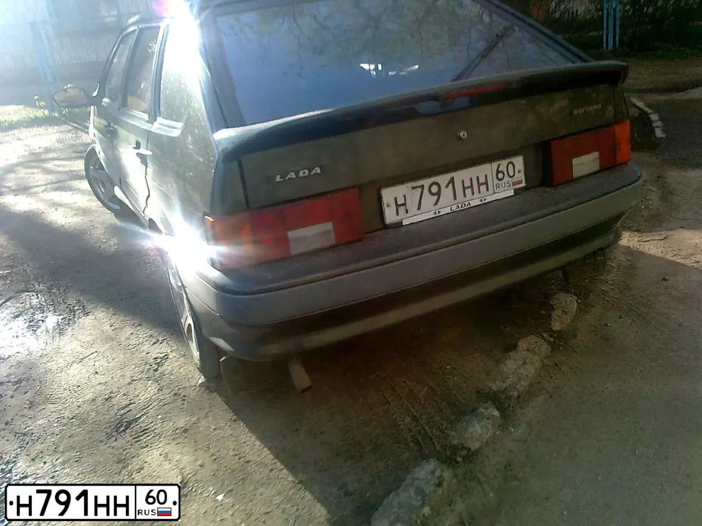 Фото автомобиля LADA 2114 SAMARA, 2006 — госномер Н791НН60. Цвет: ЗОЛОТИСТЫЙ ТЕМНО-ЗЕЛЕНЫЙ