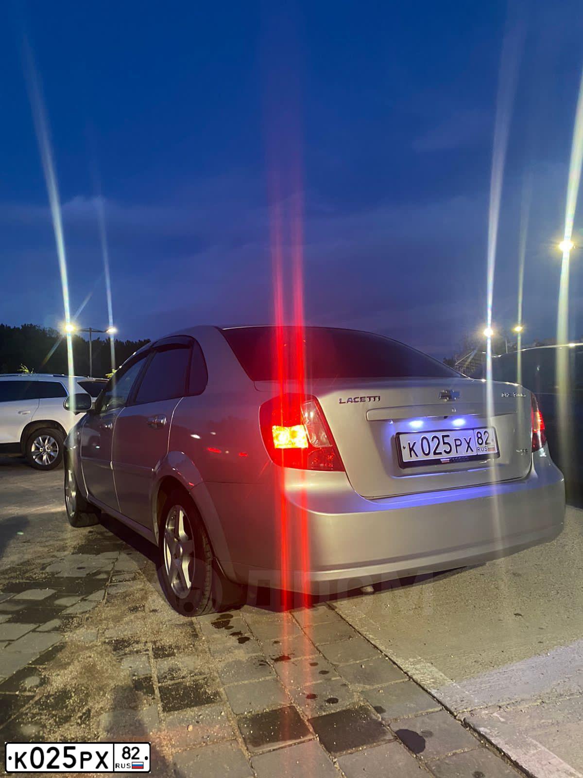 Фото автомобиля CHEVROLET LACETTI, 2007 — госномер К025РХ82. Цвет: СЕРЕБРИСТЫЙ