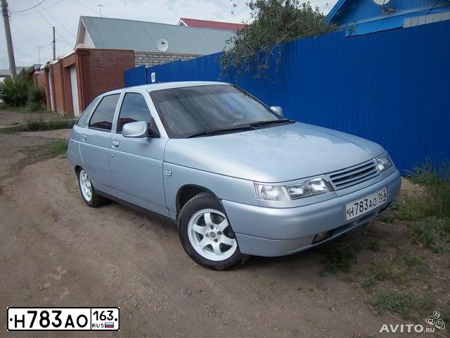 Фото автомобиля LADA 2112, 2004 — госномер В971АМ164. Цвет: Серебристо-Желтый