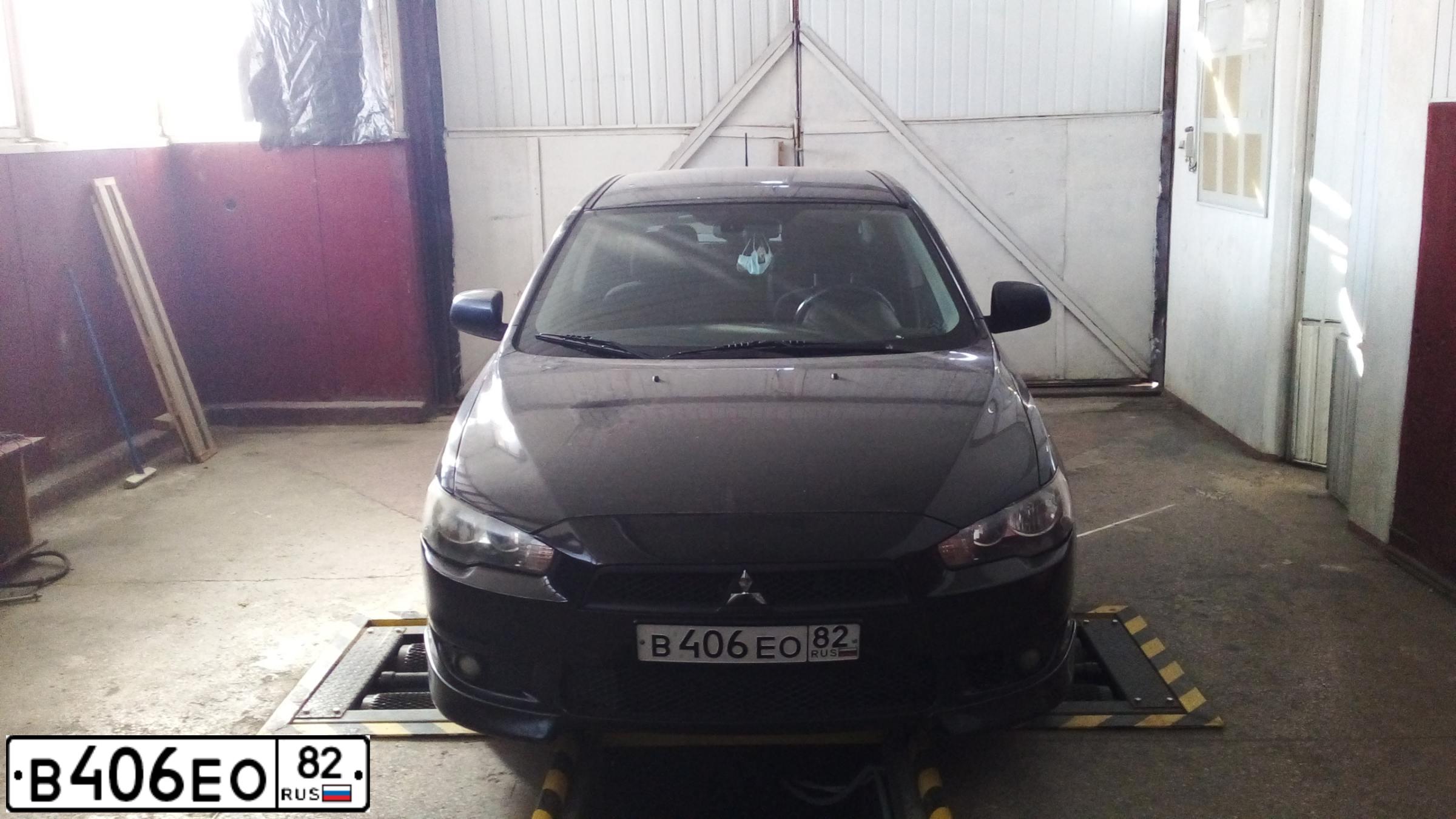 Фото автомобиля MITSUBISHI LANCER, 2007 — госномер В406ЕО82. Цвет: ЧЕРНЫЙ